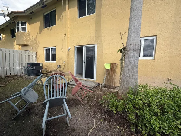 a view of balcony with furniture