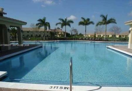 940 Northeast 33rd Terrace, Unit 101 Homestead, FL 33033 - Photo 18 of 20 a view of a lake
