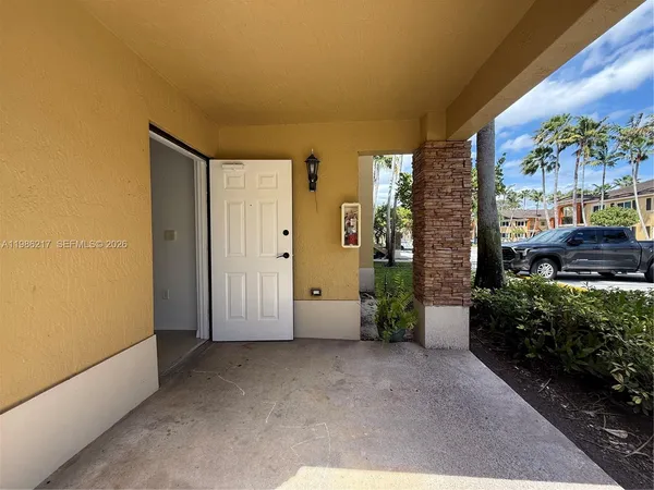 a view of a room with a lot of flower plants