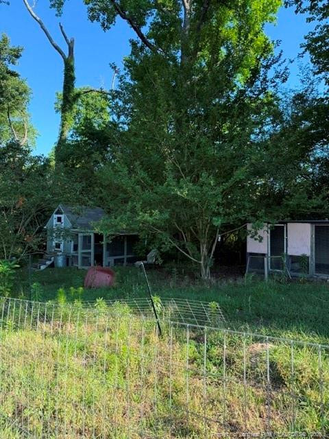 1284 L L Cooper Road Cameron, NC 28326 - Photo 24 of 24 a view of a house with a yard