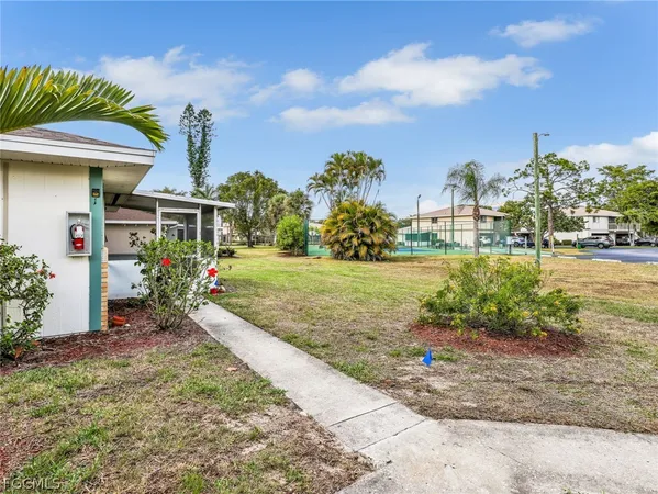a view of a garden with a apartment