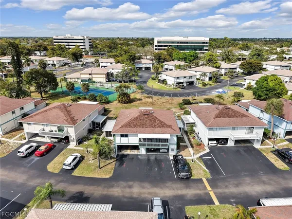 an aerial view of residential houses with outdoor space