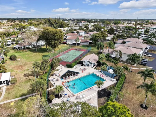 an aerial view of a house with a lake view