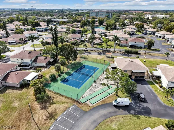 an aerial view of residential houses with outdoor space
