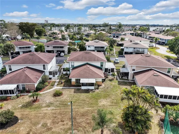 an aerial view of residential houses with outdoor space