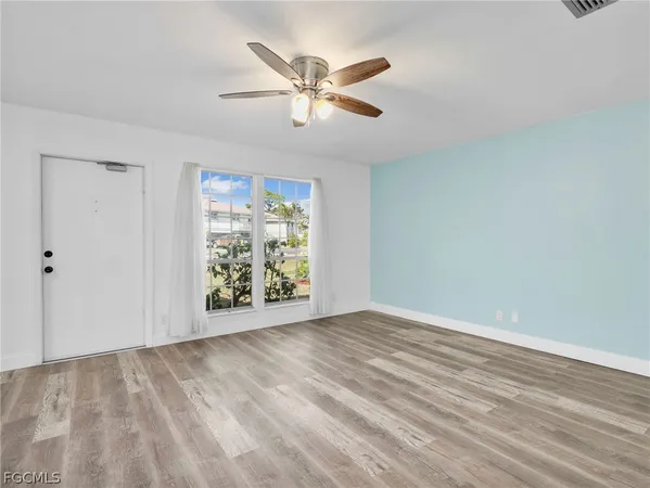 a view of an empty room with a window