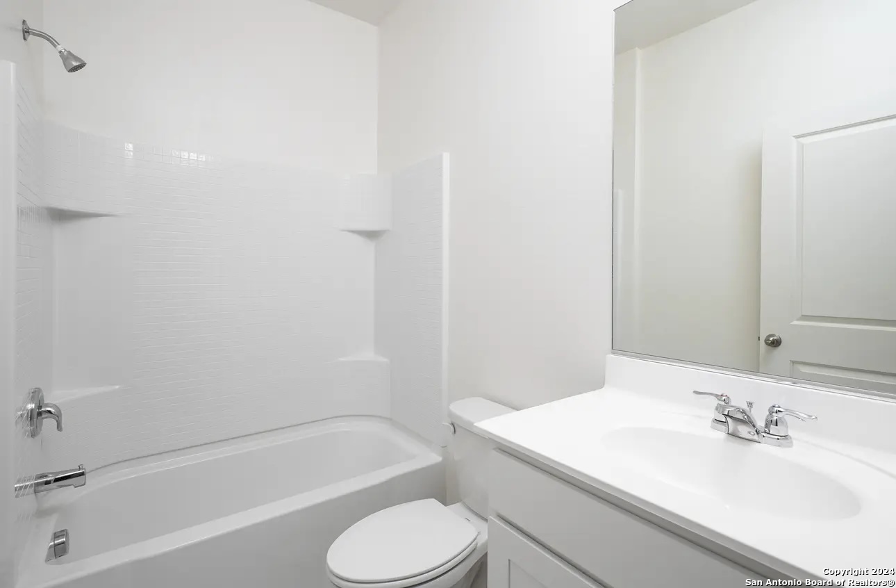 10536 Lesser Snow Adkins, TX 78101 - Photo 10 of 12 a bathroom with a sink toilet and bathtub