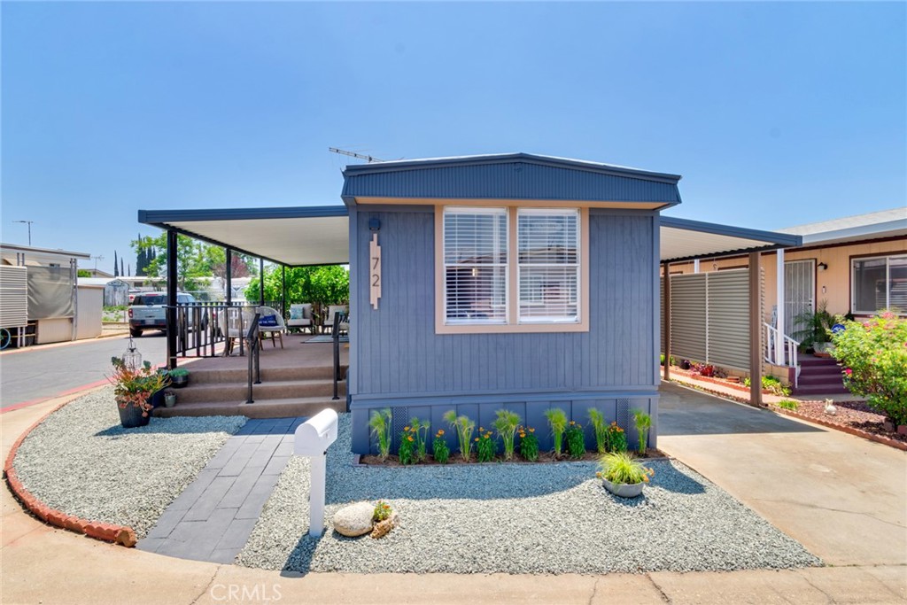 975 California Street, Unit 72 Calimesa, CA 92320 - Photo 2 of 23 a front view of a house with garden