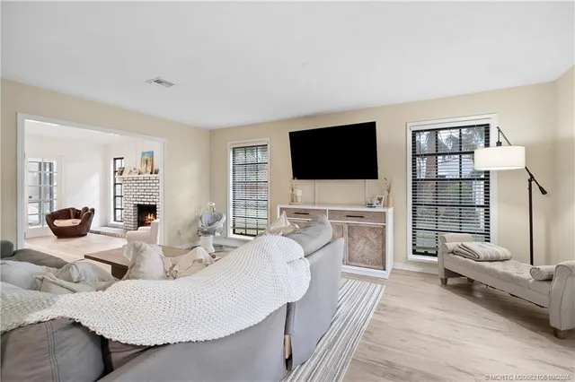 a living room with furniture window and flat screen tv