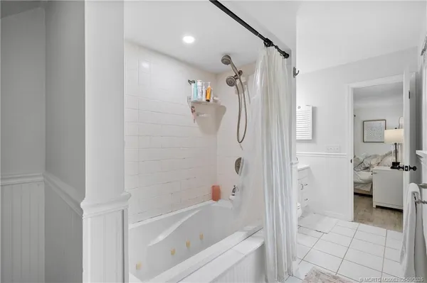 a bathroom with a sink a mirror and shower