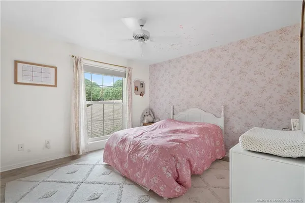 an aerial view of a house with a yard and garden