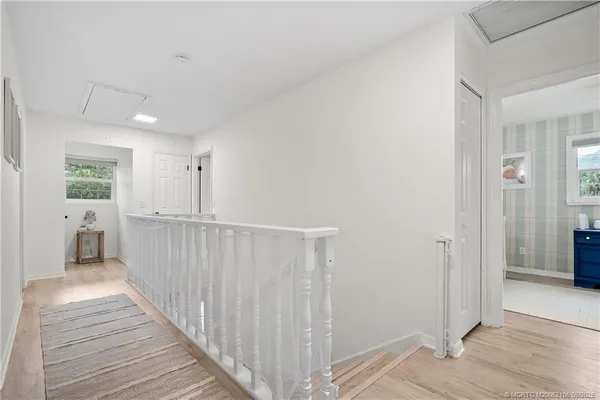an aerial view of a house with garden space and street view