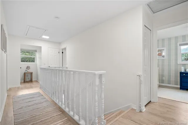 an aerial view of a house with garden space and street view