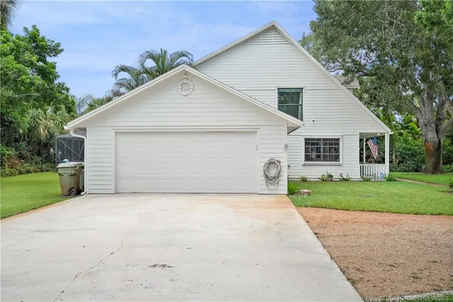 a view of a yard in front view of a house