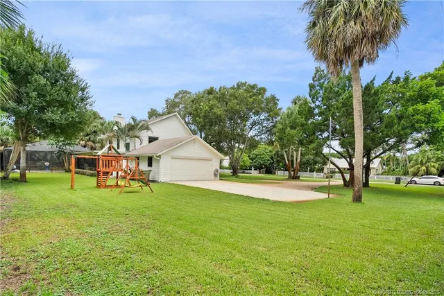 a view of a house with a yard porch and sitting area