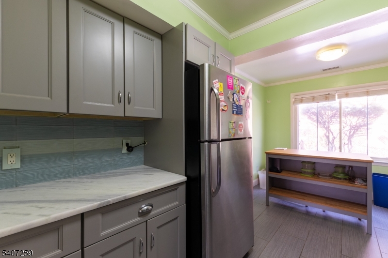 614 West 8th Street, Unit 15 Plainfield, NJ 07060 - Photo 12 of 28 a kitchen with refrigerator and window