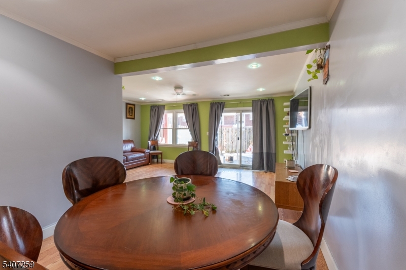 614 West 8th Street, Unit 15 Plainfield, NJ 07060 - Photo 5 of 28 a view of a dining room with furniture and wooden floor