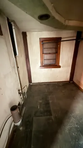 a view of a room with wooden walls