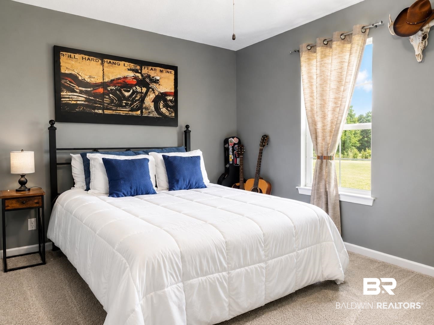 21733 Sedlack Road Silverhill, AL 36576 - Photo 18 of 22 Carpeted bedroom featuring a large window, neutral wall paint, and a ceiling fan