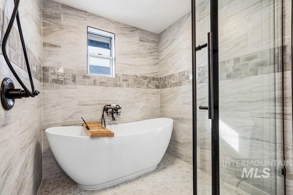 253 West Court Street Weiser, ID 83672 - Photo 24 of 35 Full bath featuring tile walls and a freestanding tub