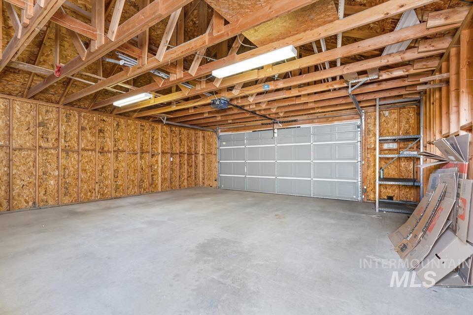 253 West Court Street Weiser, ID 83672 - Photo 31 of 35 Garage featuring a garage door opener