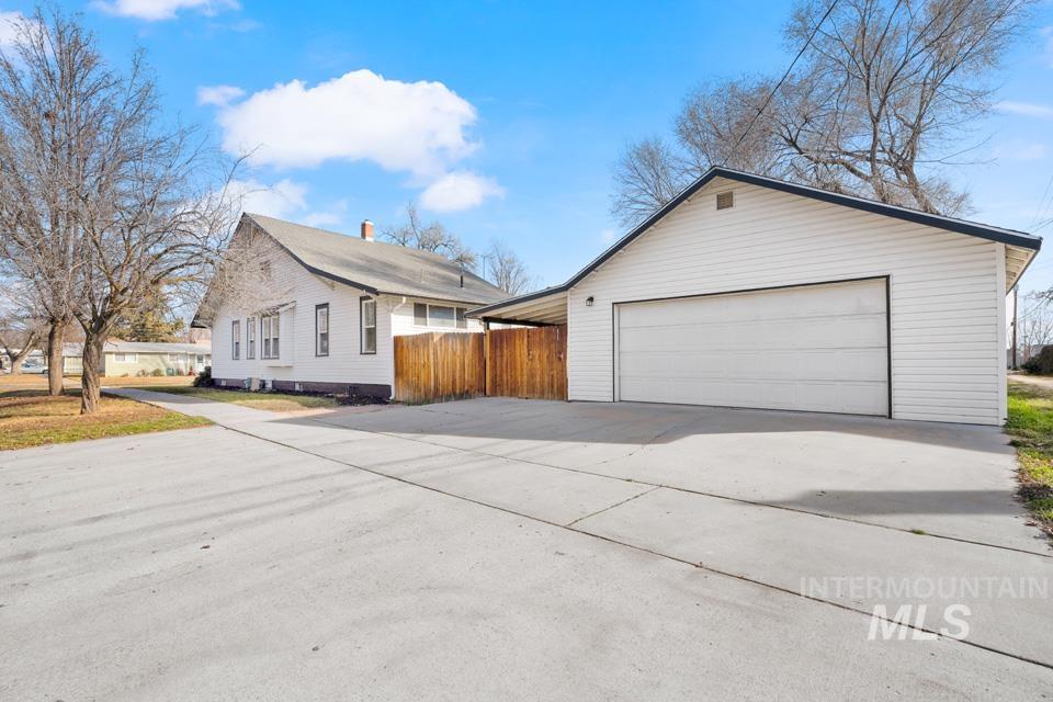 253 West Court Street Weiser, ID 83672 - Photo 33 of 35 View of home's exterior featuring a garage and an outdoor structure