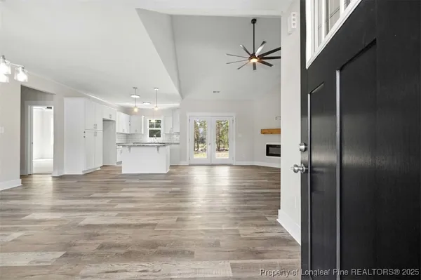 a view of a kitchen with a sink and a cabinet