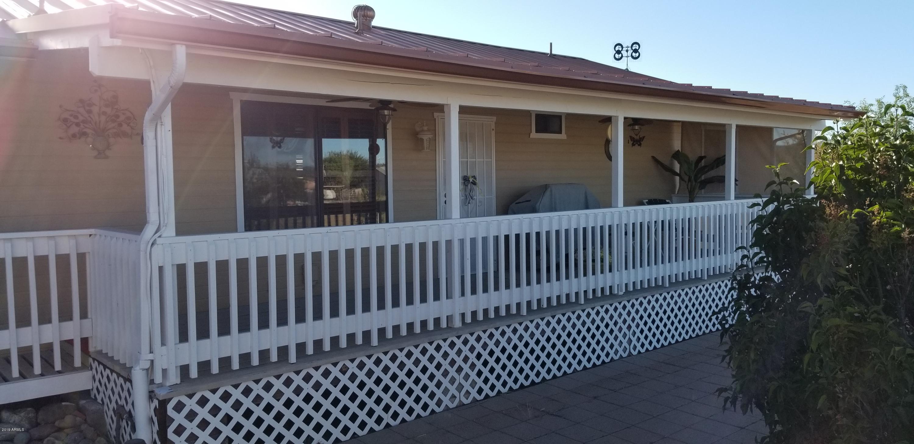 18653 Aggie Hodge Road Peeples Valley, AZ 86332 - Photo 33 of 65 rear patio main house
