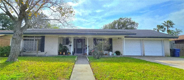 a view of a house with pool and garden