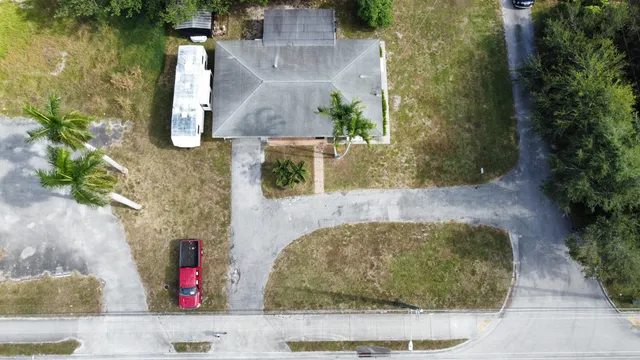 an aerial view of a house with outdoor space