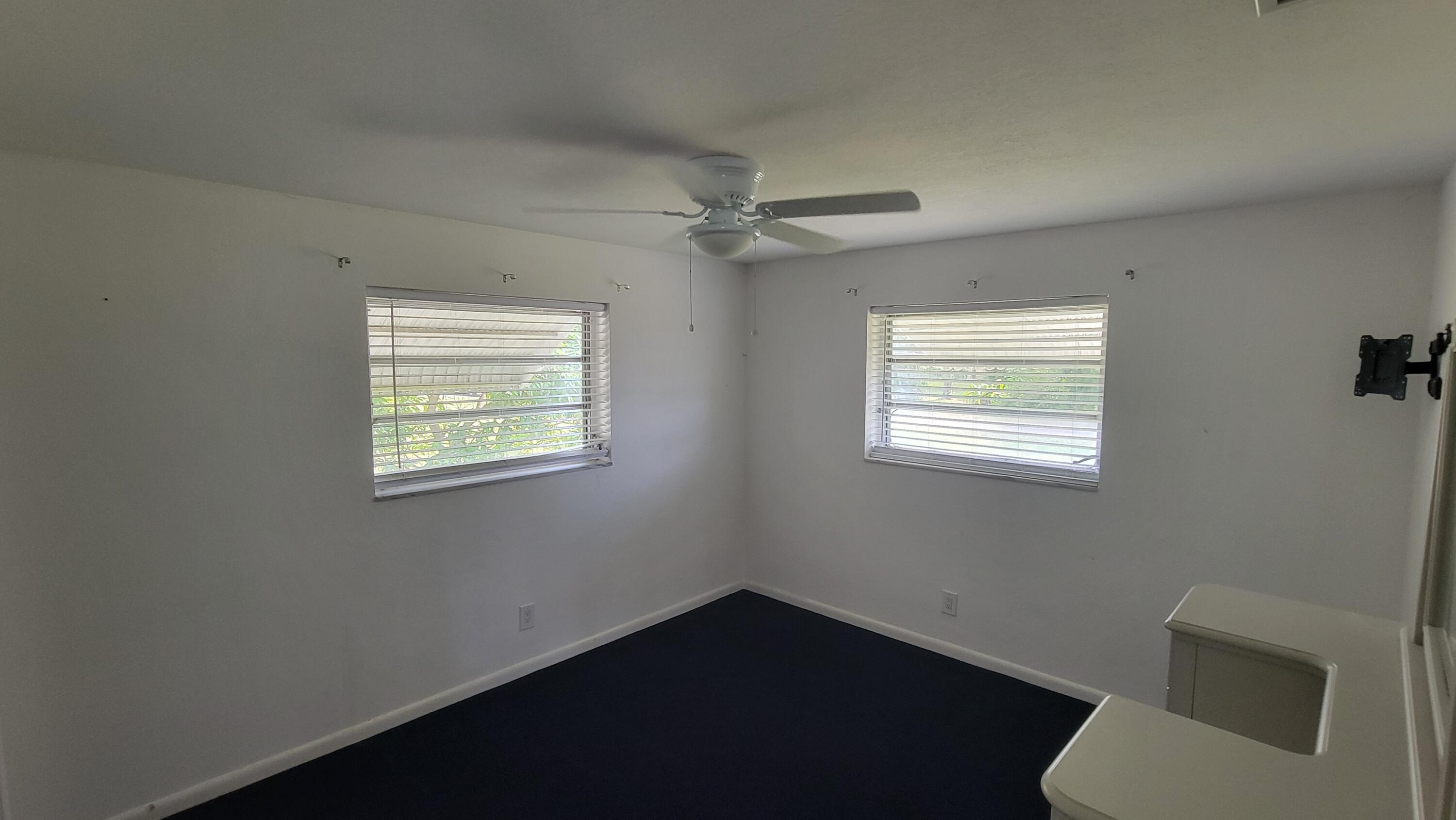 3340 Jog Road Greenacres, FL 33467 - Photo 12 of 20 a view of an empty room with a window