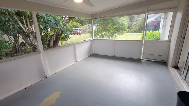 a view of an empty room and a window