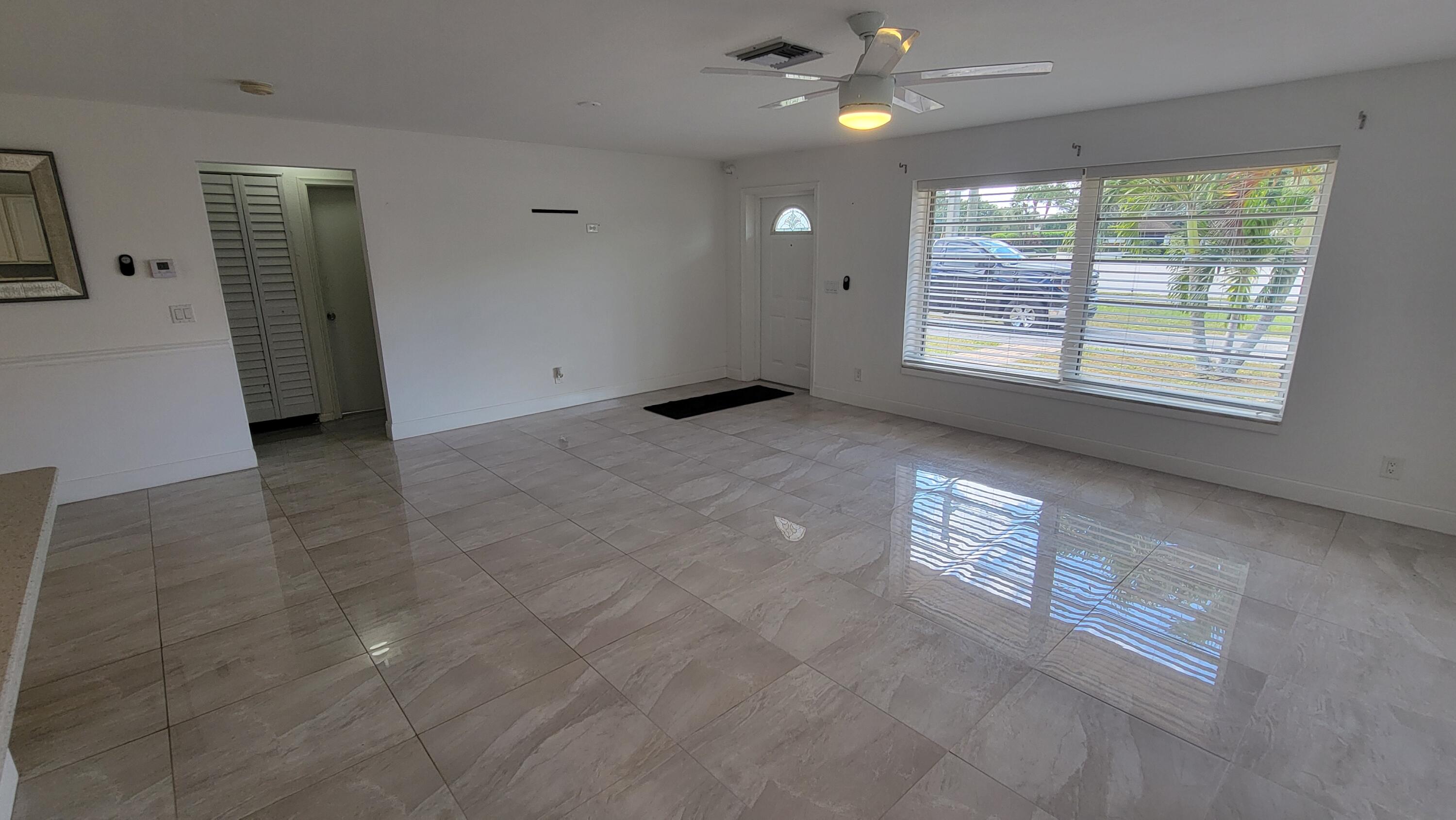 3340 Jog Road Greenacres, FL 33467 - Photo 10 of 20 an empty room with windows and closet