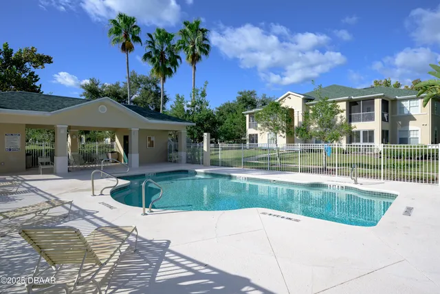 a view of a house with a swimming pool