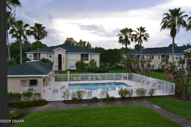 a view of a house with a garden