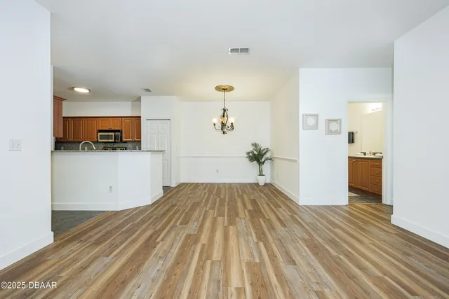 a view of a kitchen from the hallway