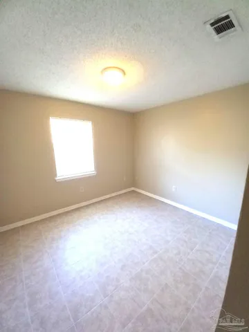 an empty room with a empty space and a window