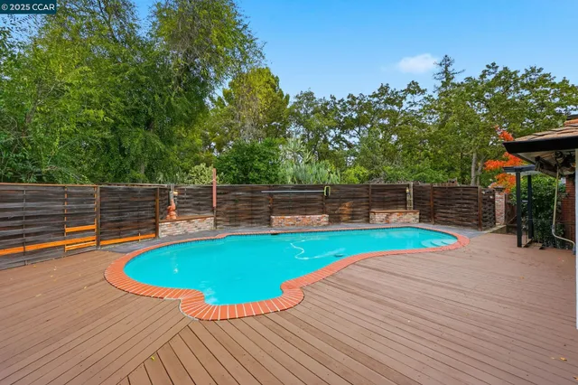 a view of a swimming pool with a lounge chairs