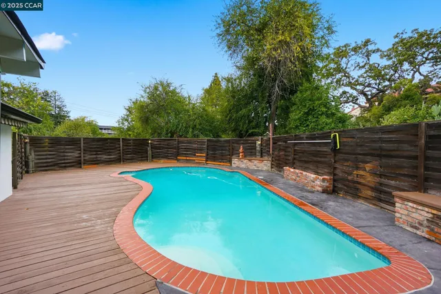 a view of a swimming pool with a seating space