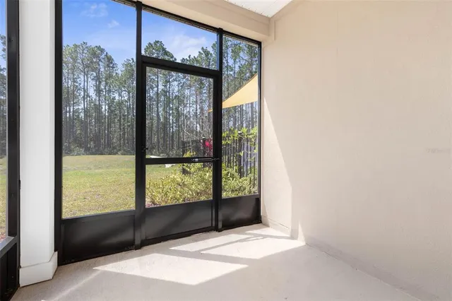 a view of a glass door with a outdoor space