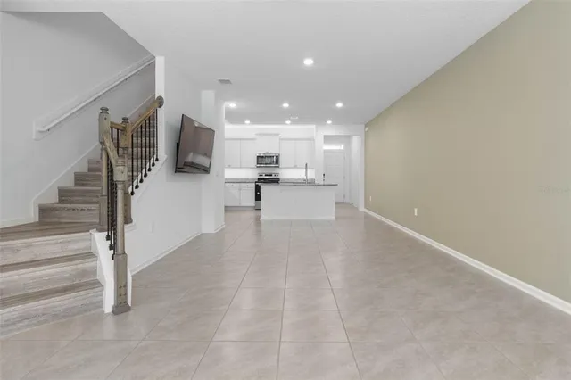 a view of a kitchen with a sink and cabinets