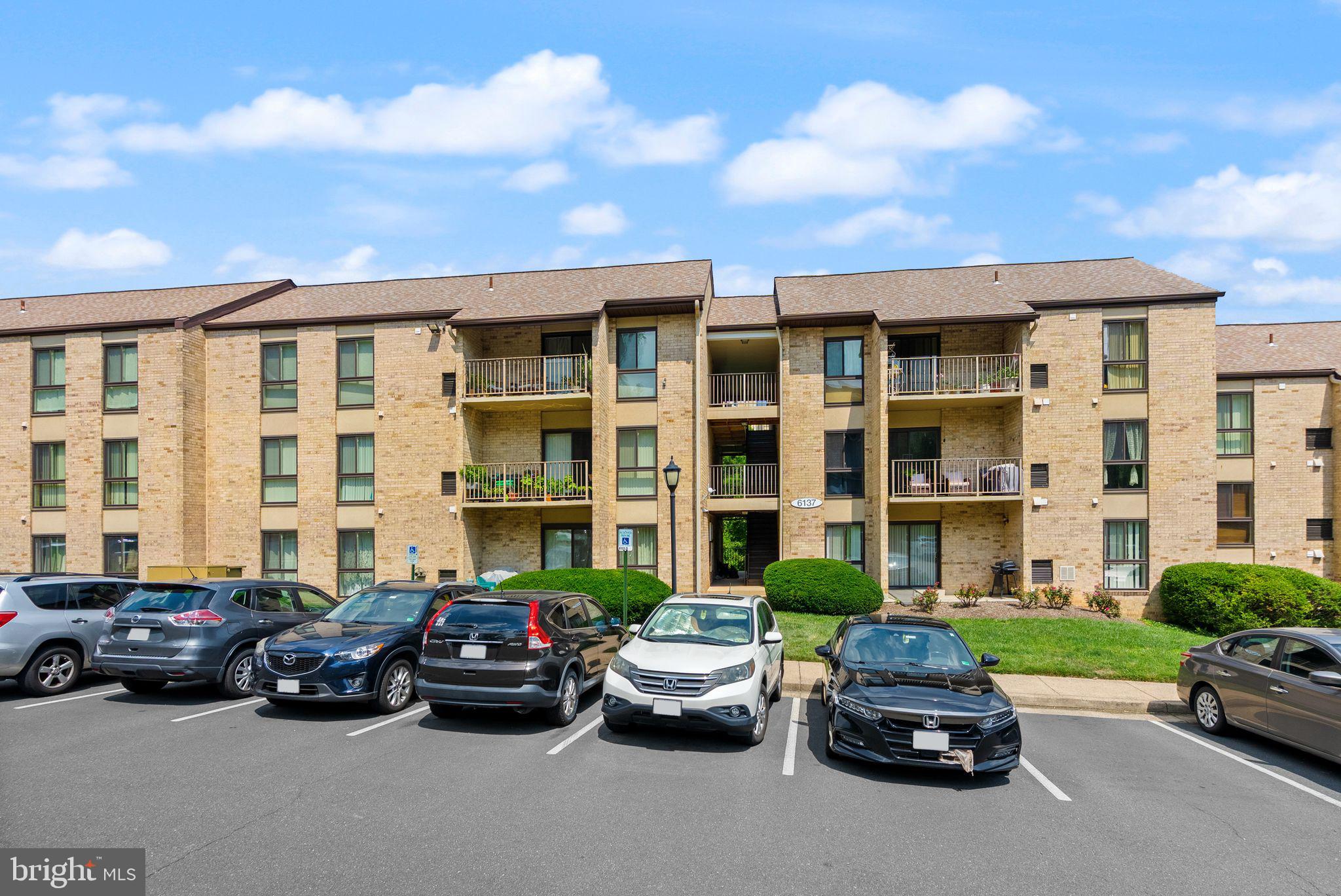 6137 Edsall Road, Unit L Alexandria, VA 22304 - Photo 1 of 36 a car parked in front of a house and a parking space