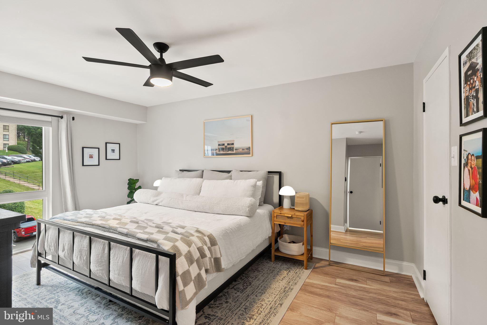 6137 Edsall Road, Unit L Alexandria, VA 22304 - Photo 23 of 36 a bedroom with a bed and a chandelier