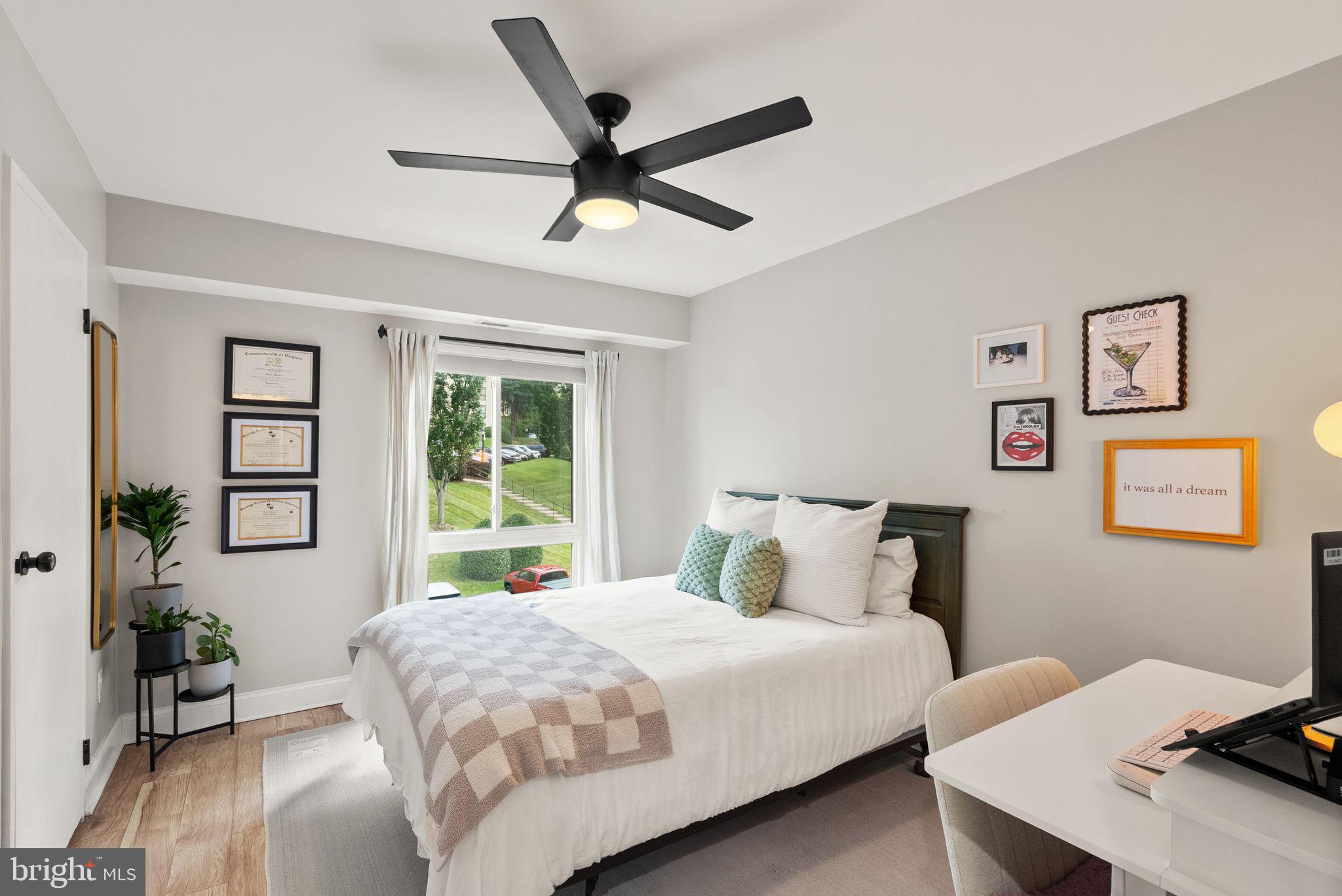 6137 Edsall Road, Unit L Alexandria, VA 22304 - Photo 29 of 36 a bedroom with a large bed and a window