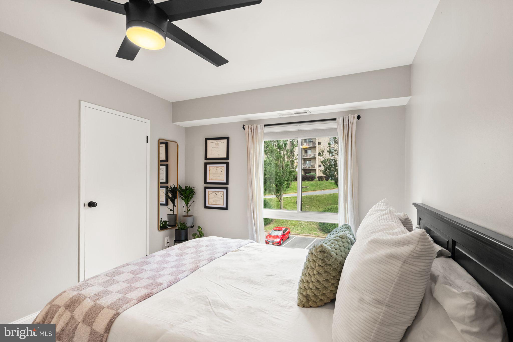 6137 Edsall Road, Unit L Alexandria, VA 22304 - Photo 30 of 36 a bedroom with a bed and a window