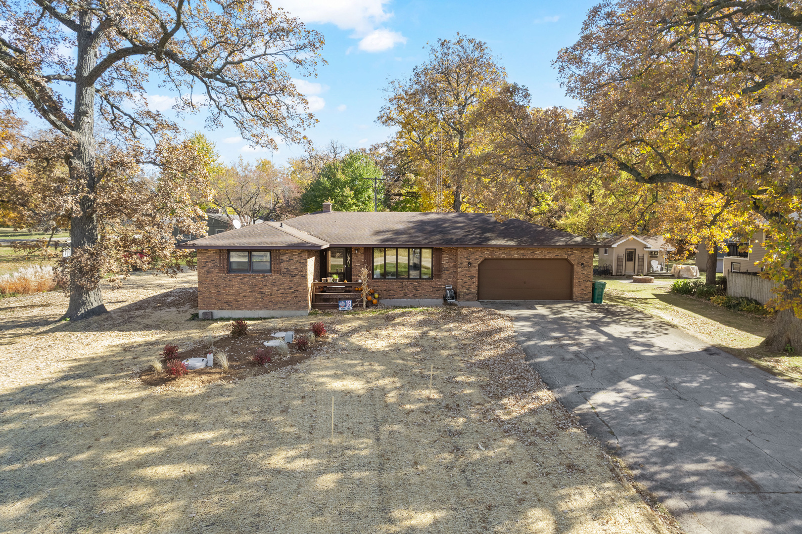 33844 North State Road Genoa, IL 60135 - Photo 1 of 33 a front view of a house with a garden