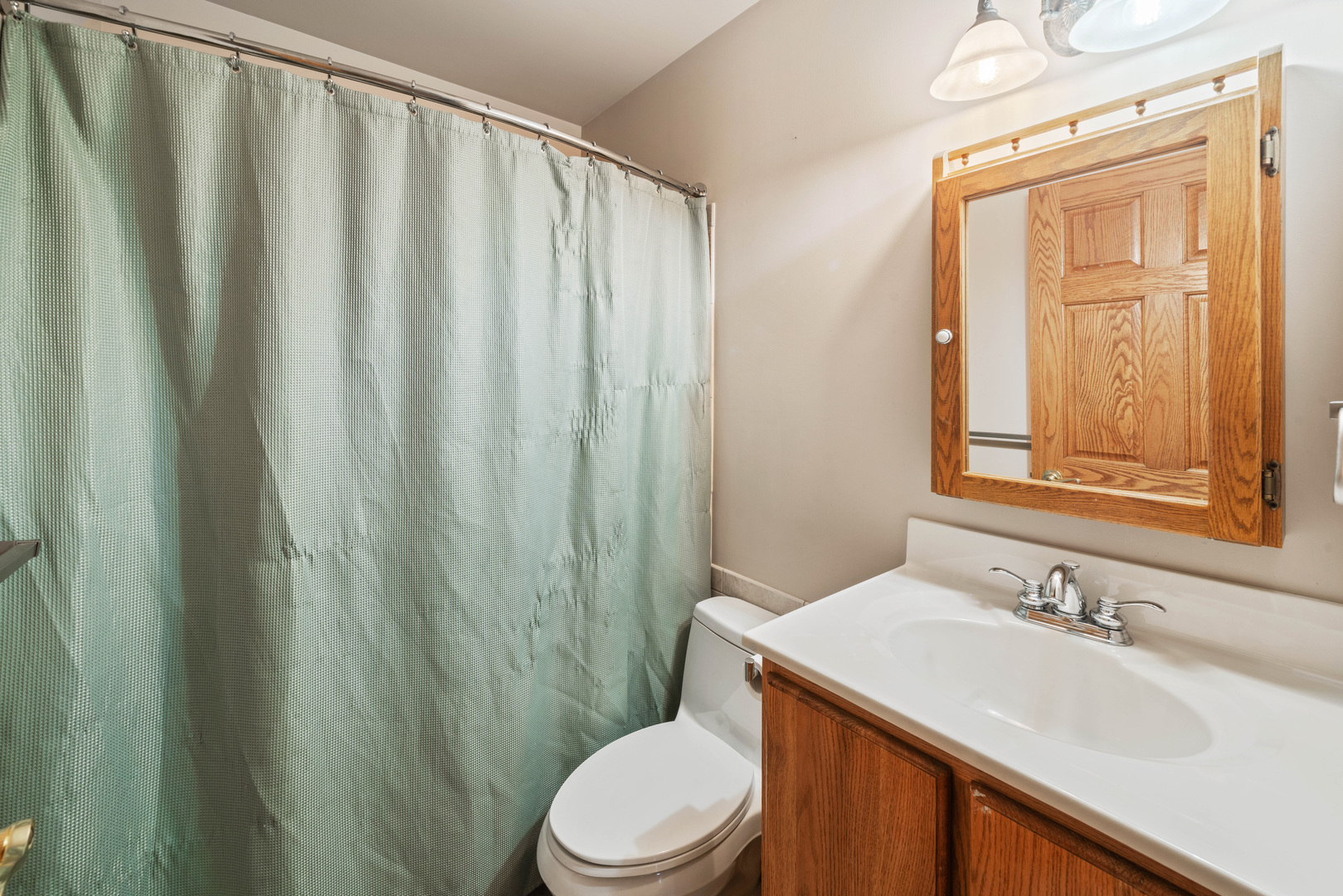 33844 North State Road Genoa, IL 60135 - Photo 17 of 33 a bathroom with a sink a toilet and shower