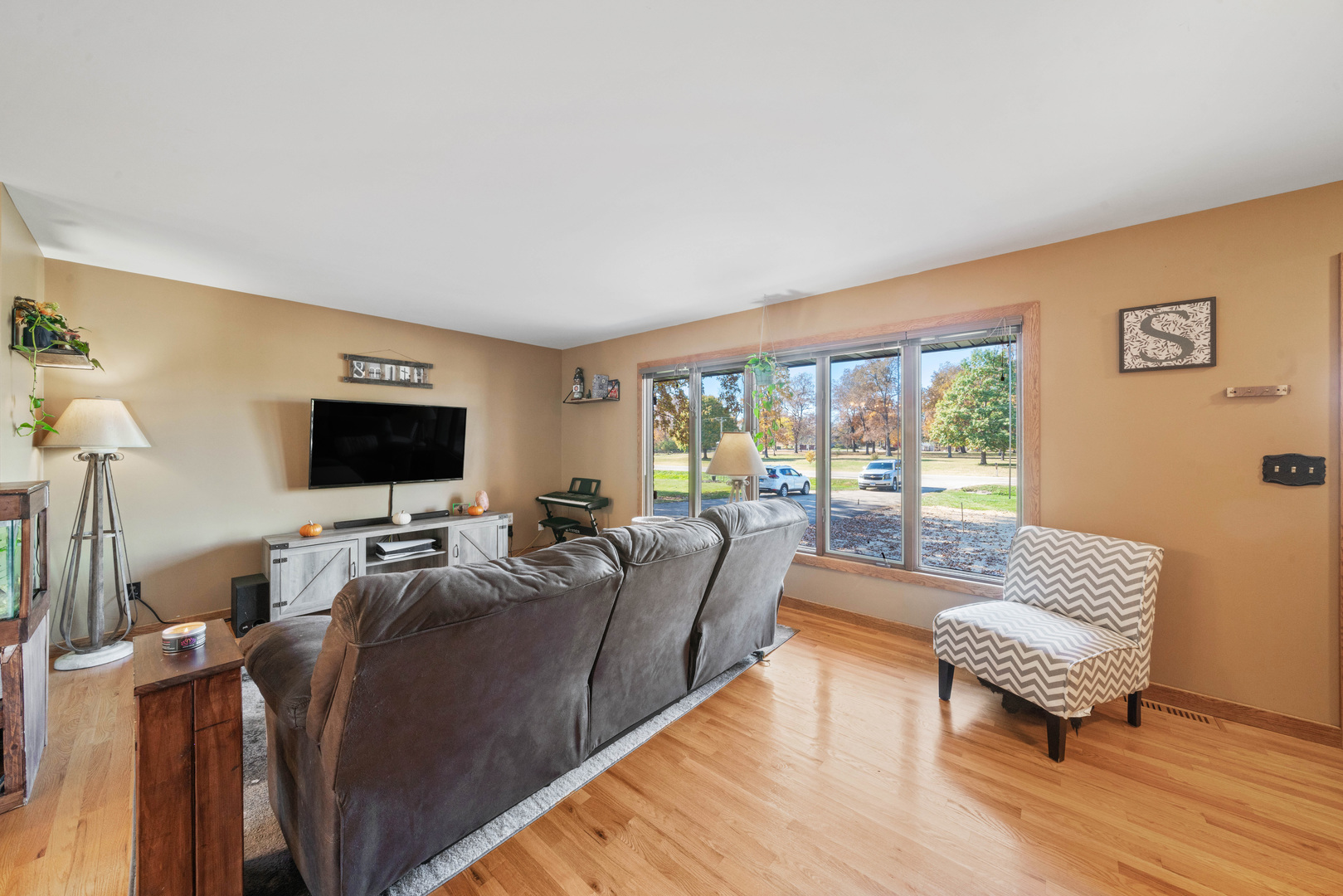 33844 North State Road Genoa, IL 60135 - Photo 4 of 33 a living room with furniture and a flat screen tv