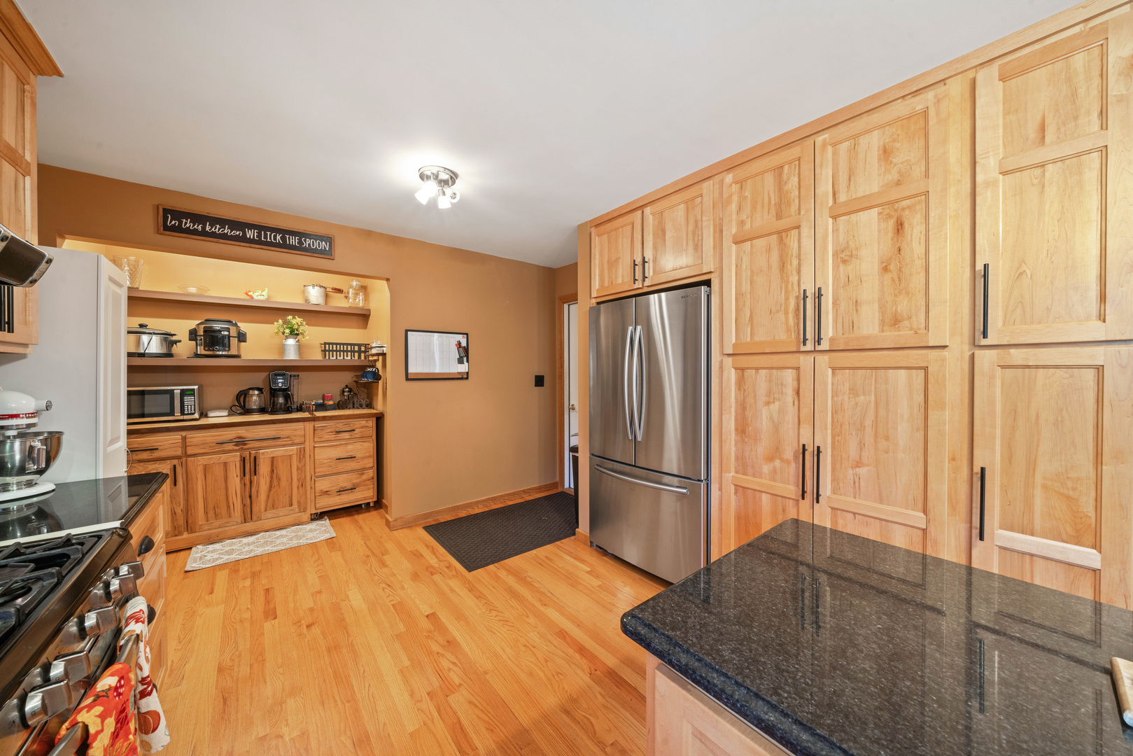 33844 North State Road Genoa, IL 60135 - Photo 10 of 33 a kitchen with stainless steel appliances a refrigerator and wooden cabinets