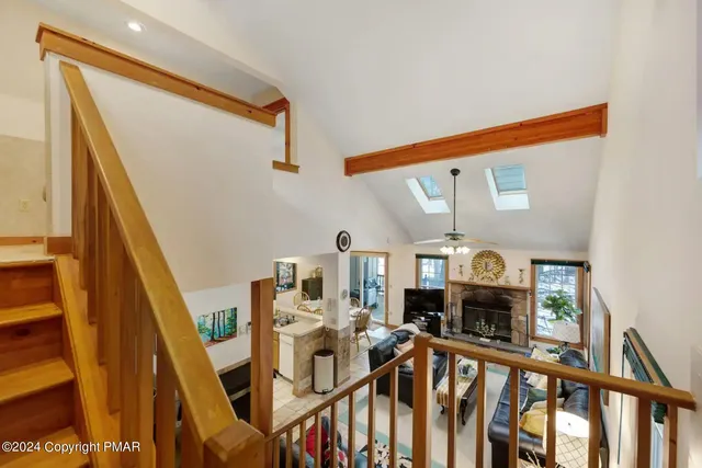 a view of living room with furniture and fireplace